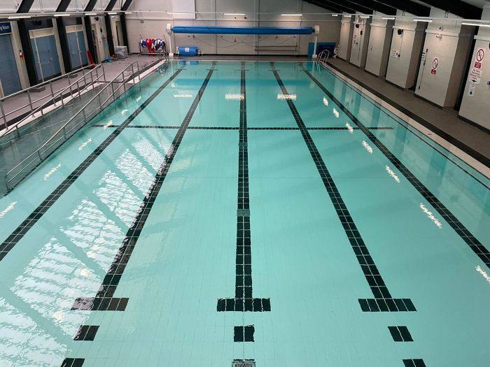 The refilled pool after the full rip-out, retile and epoxy-grout refurbishment.