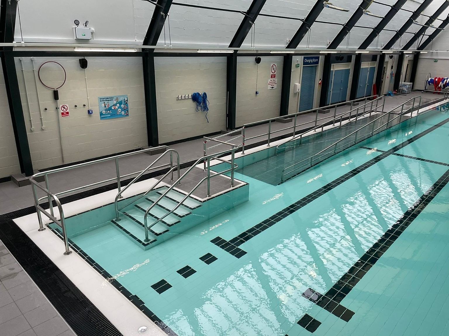 The finished access steps and handrails, seen from the pool.