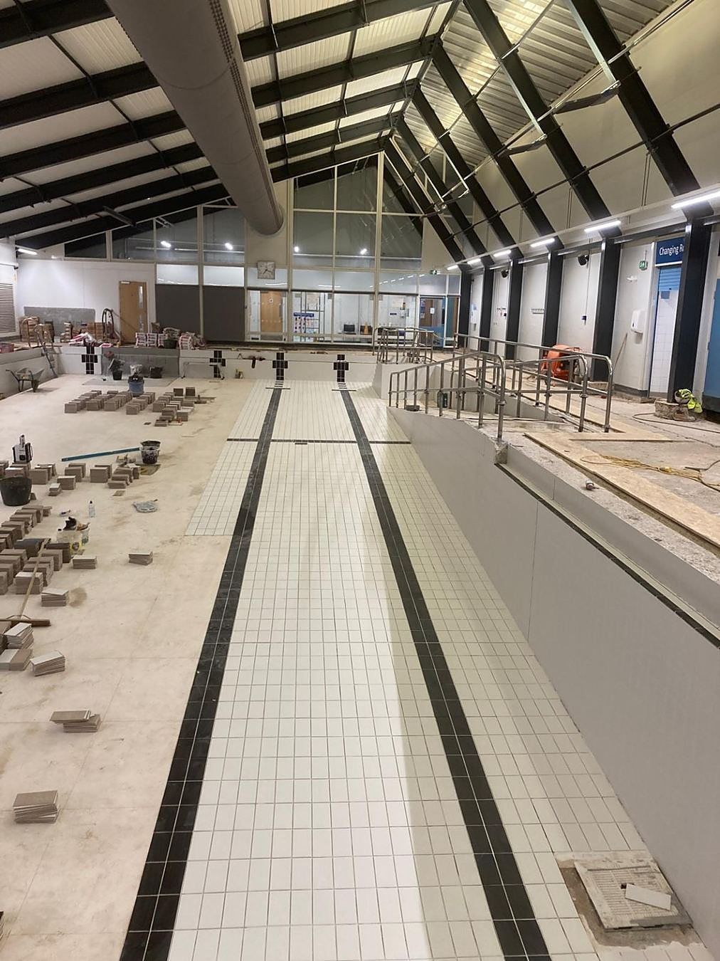New floor tiles and lane markings running the length of the basin.