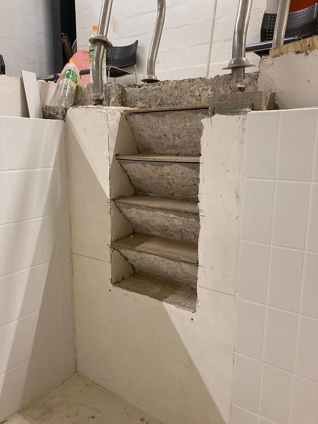 The original finish stripped from the recessed steps, ready for rebuilding.