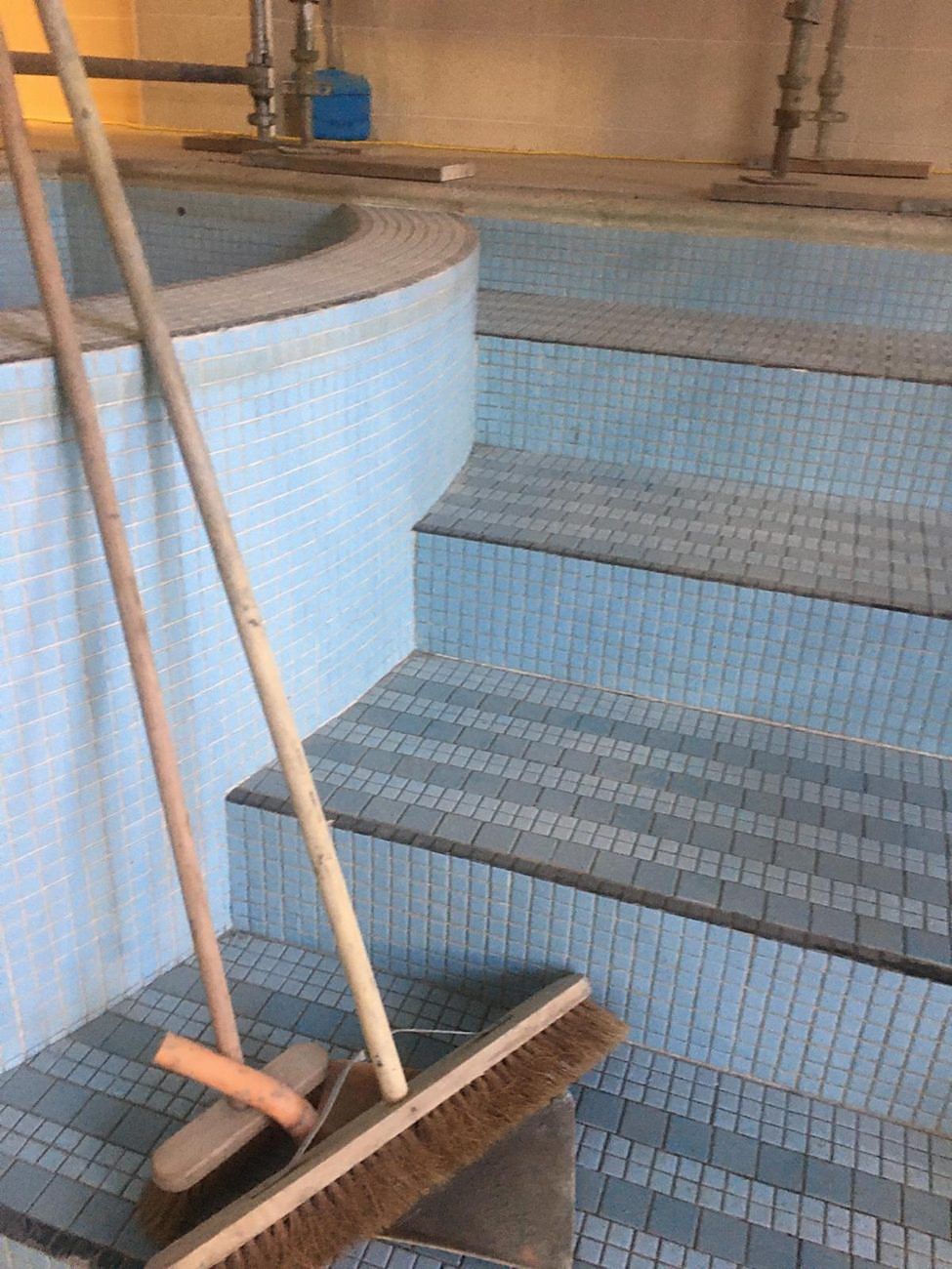 Before: the original steps and curved column seat, ready for the old tiles to come off.