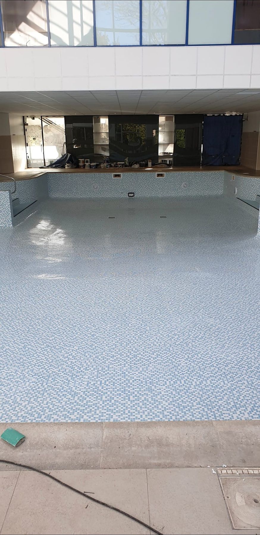 Mosaic floor and walls, looking towards the far end of the pool.