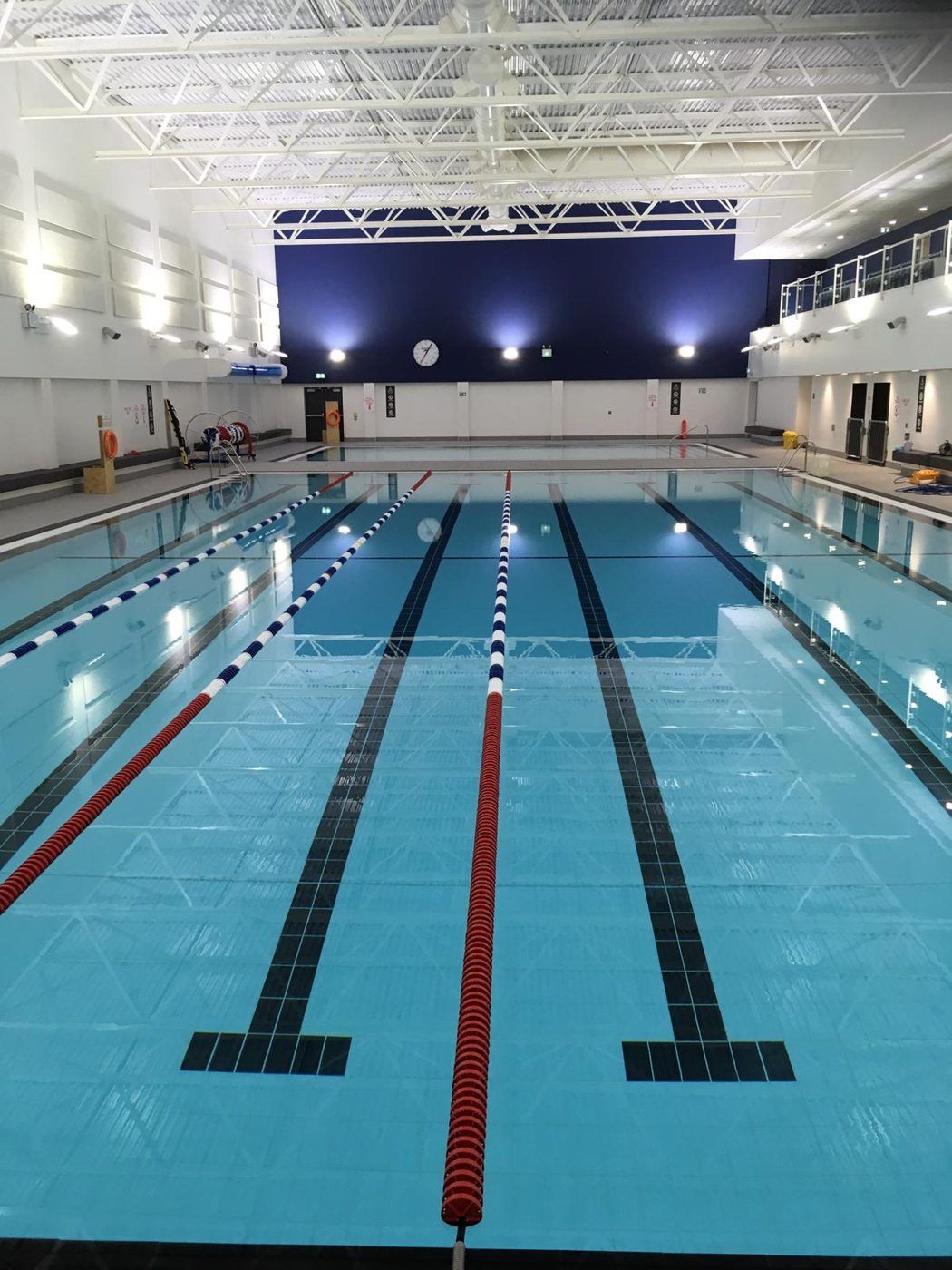Lane pool with clear water over a tiled floor