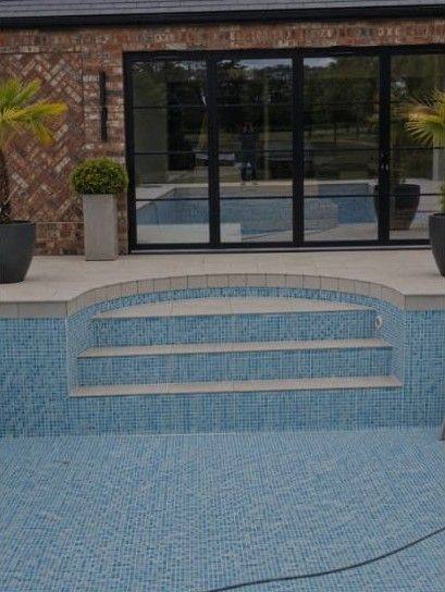 Mosaic pool finish: Mosaic tiling across the pool floor, walls and entry steps.